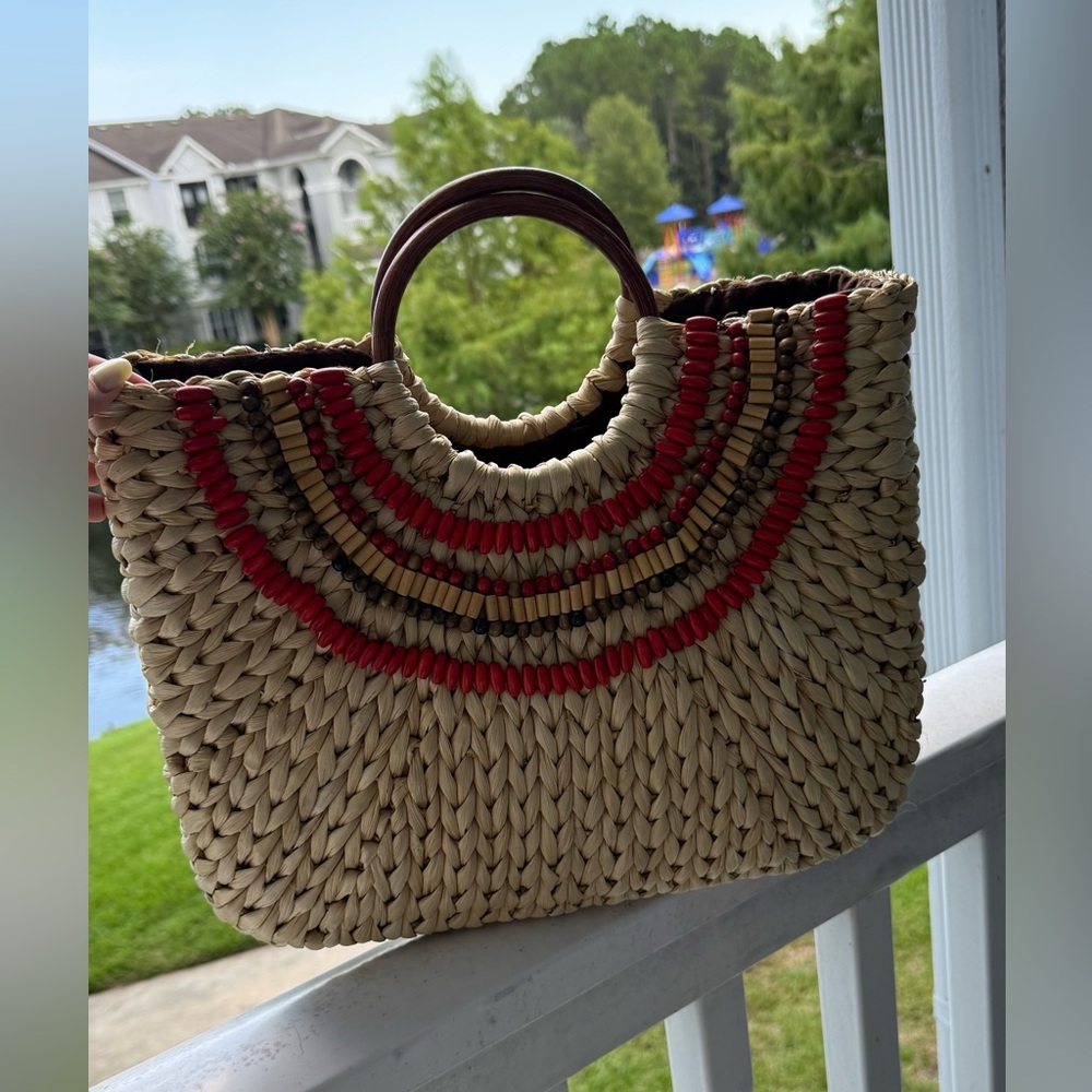 Elegant Straw Tote with Red and Brown Accents